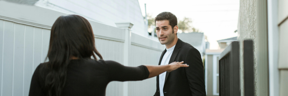 A family dinner table with an invisible line dividing it, half in warm light, half in cold shadow